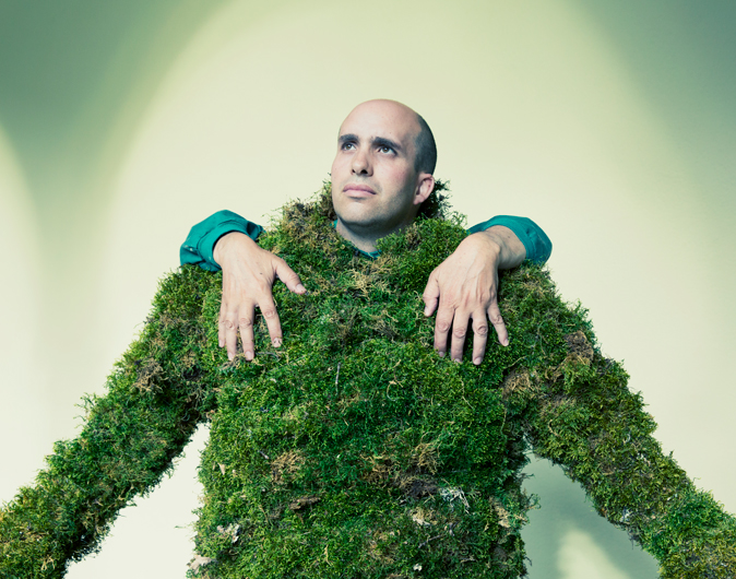 Man dressed in moss with hands on his shoulders. The Moss Men of Bejar.