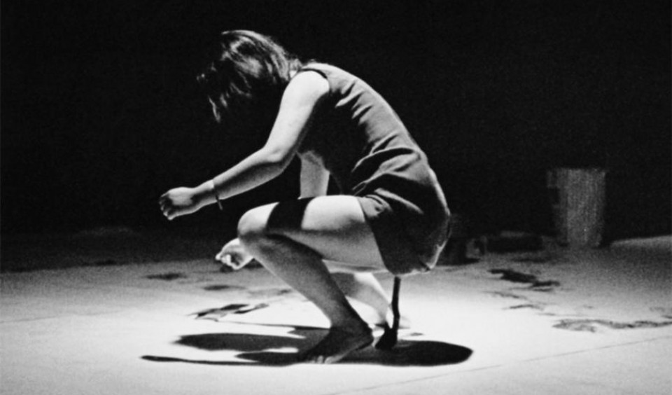 Shigeko Kubota performing her "Vagina Painting" on July 4, 1965 at Cinemateque, East 4th Street New York during The Perpetual Fluxus Festival