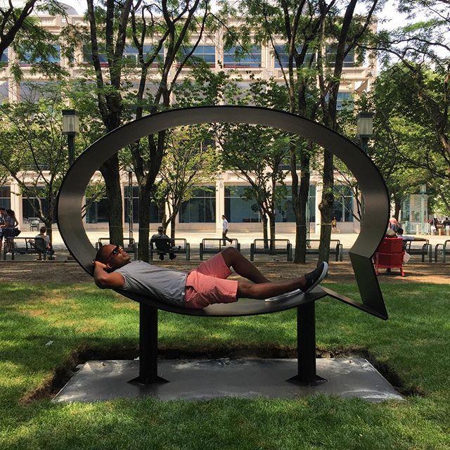 Hank lounging on one of the "Truth" sculptures, Photo: Hank Willis Thomas, via Instagram