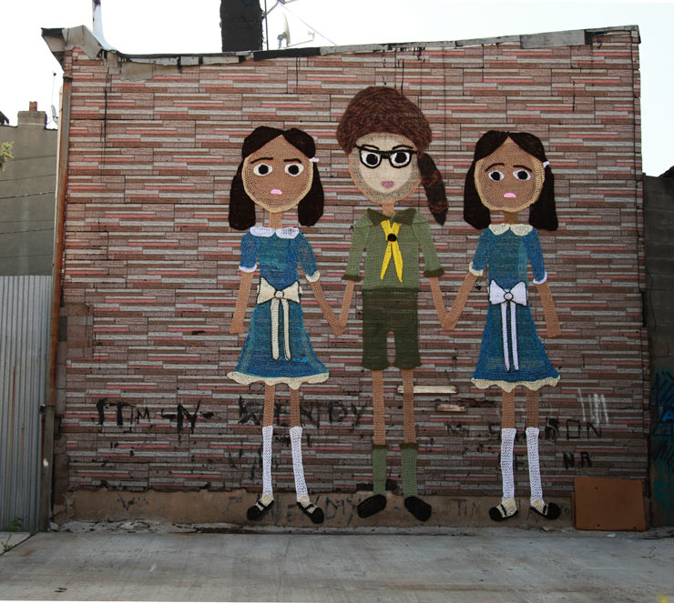 Public Art Mural by London Kaye of 3 Kids holding hands in Brooklyn New York