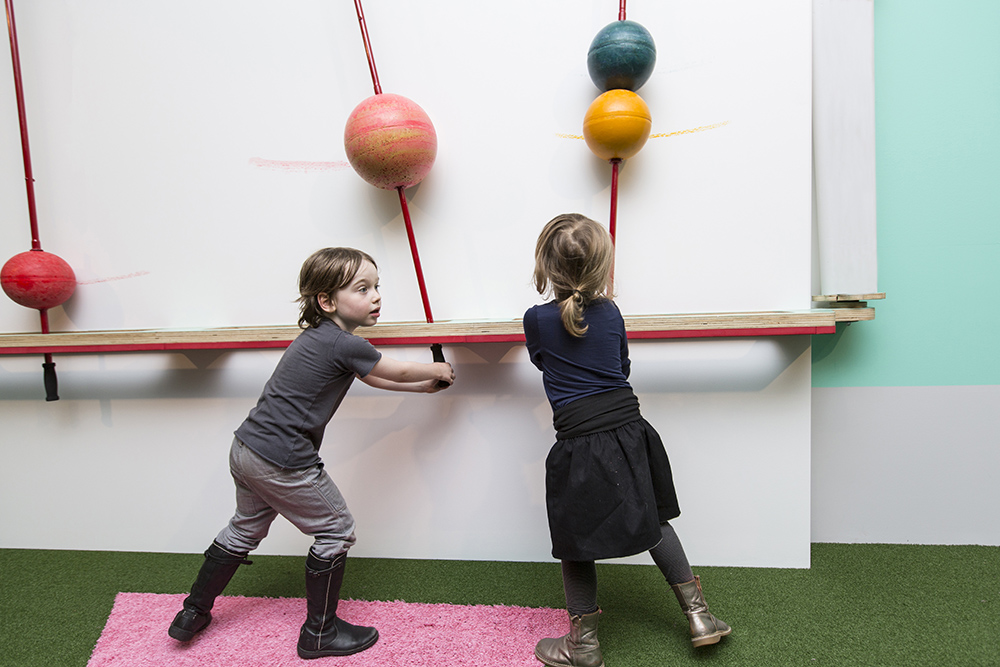 Kids playing with art installation titled Pastello by Mathery Studio