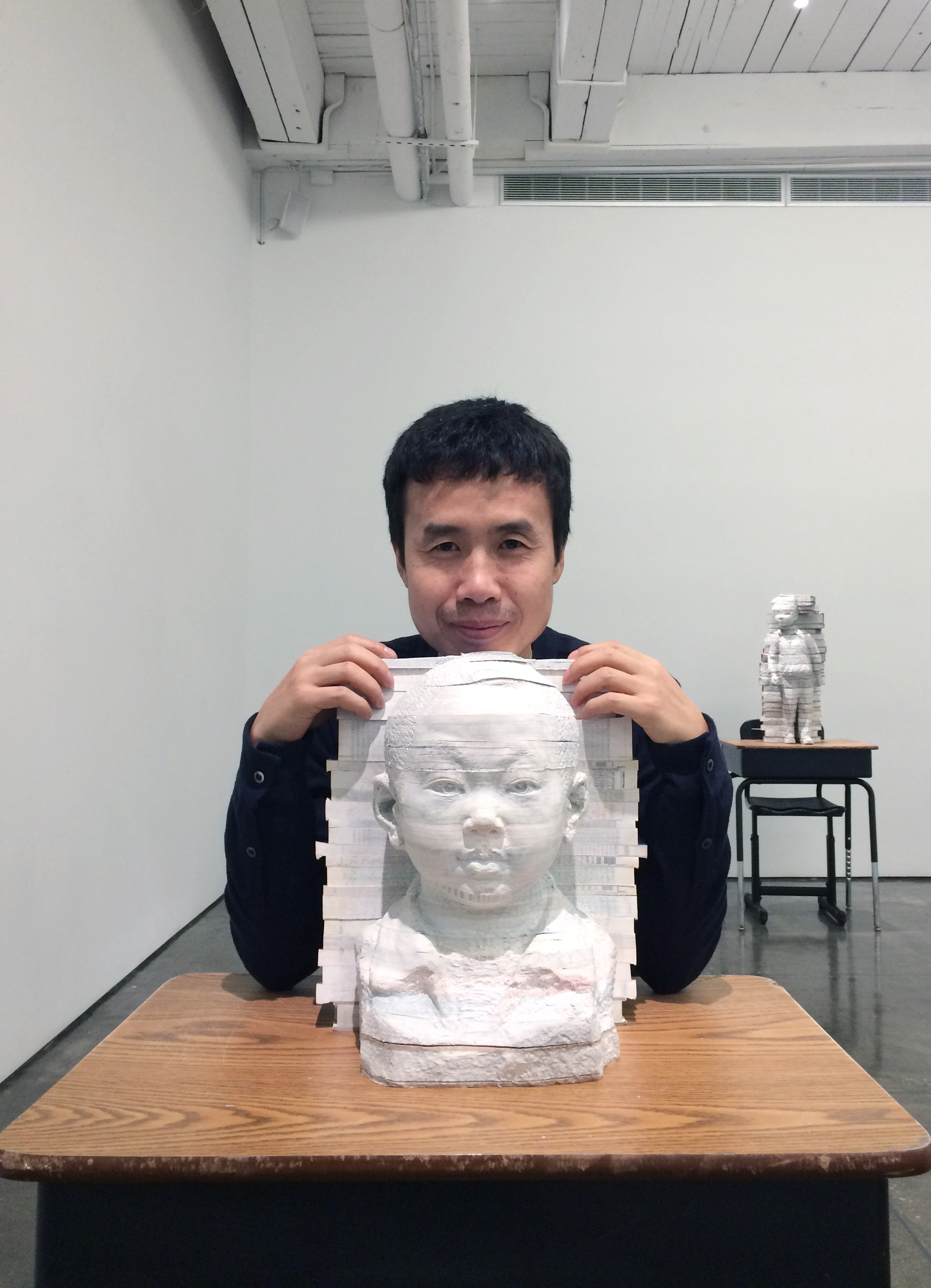 Chinese Artist Li Hongbo with Textbook Sculpture